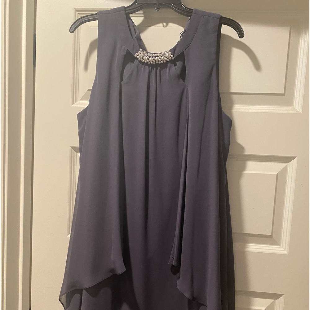 Ignite Evenings
Trapeze silhouette
Crew neckline with beaded trim
Sleeveless
